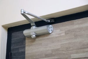 Most building codes mandate that businesses install door closers